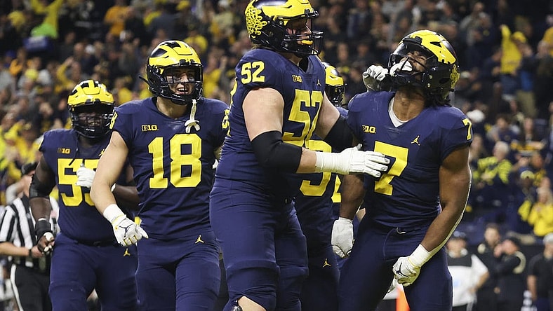 Dec 3, 2022; Indianapolis, Indiana, USA; Michigan Wolverines running back Donovan Edwards (7) celebrates after scoring on a 27-yard touchdown run during the second half of the Big Ten Championship against the Purdue Boilermakers at Lucas Oil Stadium. Mandatory Credit: Trevor Ruszkowski-USA TODAY Sports