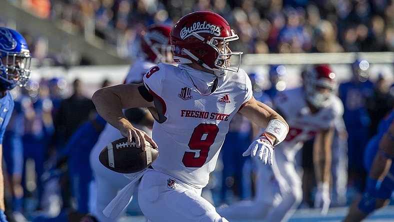 Dec 3, 2022; Boise, Idaho, USA;  Fresno State Bulldogs quarterback Jake Haener (9) rolls out during the first half of the Mountain West Championship game versus the Boise State Broncos at Albertsons Stadium. Mandatory Credit: Brian Losness-USA TODAY Sports