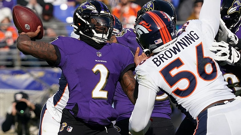 Dec 4, 2022; Baltimore, Maryland, USA; Baltimore Ravens quarterback Tyler Huntley (2) pressured in the second quarter by Denver Broncos linebacker Baron Browning (56) at M&T Bank Stadium. Mandatory Credit: Mitch Stringer-USA TODAY Sports