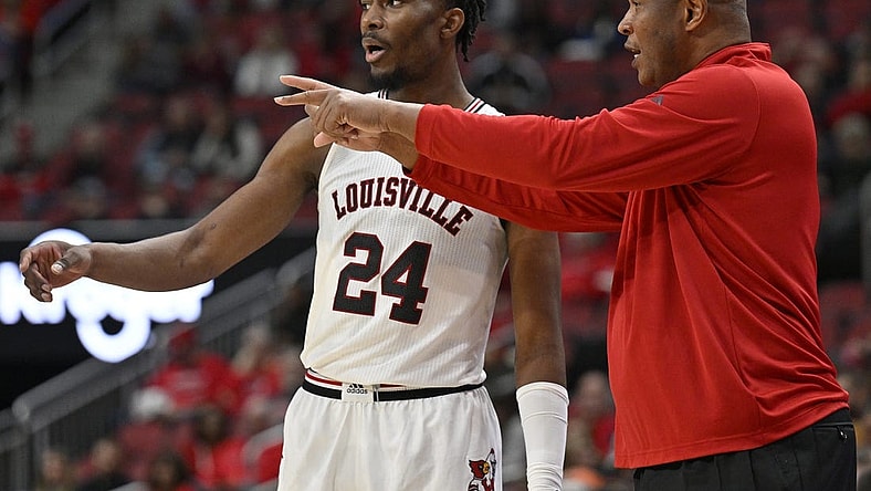 Dec 4, 2022; Louisville, Kentucky, USA;  Louisville Cardinals head coach Kenny Payne talks with forward Jae'Lyn Withers (24) during the second half against the Miami (Fl) Hurricanes at KFC Yum! Center. Miami defeated Louisville 80-53. Mandatory Credit: Jamie Rhodes-USA TODAY Sports