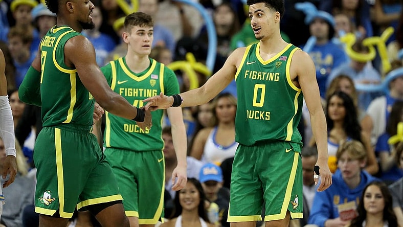 Dec 4, 2022; Los Angeles, California, USA; Oregon Ducks guard Will Richardson (0) greets forward Quincy Guerrier (13) during the second half against the UCLA Bruins at Pauley Pavilion presented by Wescom. Mandatory Credit: Kiyoshi Mio-USA TODAY Sports