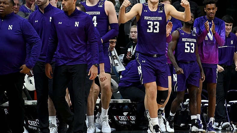 Dec 4, 2022; East Lansing, Michigan, USA; Northwestern Wildcats forward Luke Hunger (33) celebrates their win against the Michigan State Spartans at Jack Breslin Student Events Center. Mandatory Credit: Dale Young-USA TODAY Sports