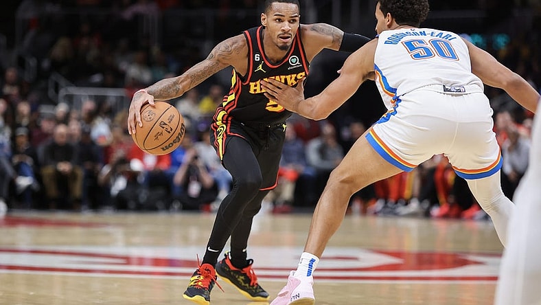 Dec 5, 2022; Atlanta, Georgia, USA; Atlanta Hawks guard Dejounte Murray (5) drives to the basket against the Oklahoma City Thunder in the second quarter at State Farm Arena. Mandatory Credit: Brett Davis-USA TODAY Sports