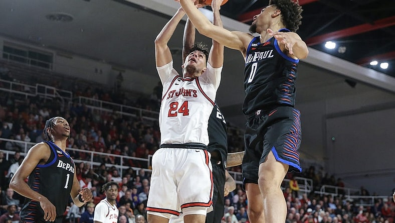 Dec 7, 2022; Queens, New York, USA; St. John's Red Storm guard Rafael Pinzon (24) shoots over DePaul Blue Demons guard Zion Cruz (0) in the second half at Carnesecca Arena. Mandatory Credit: Wendell Cruz-USA TODAY Sports