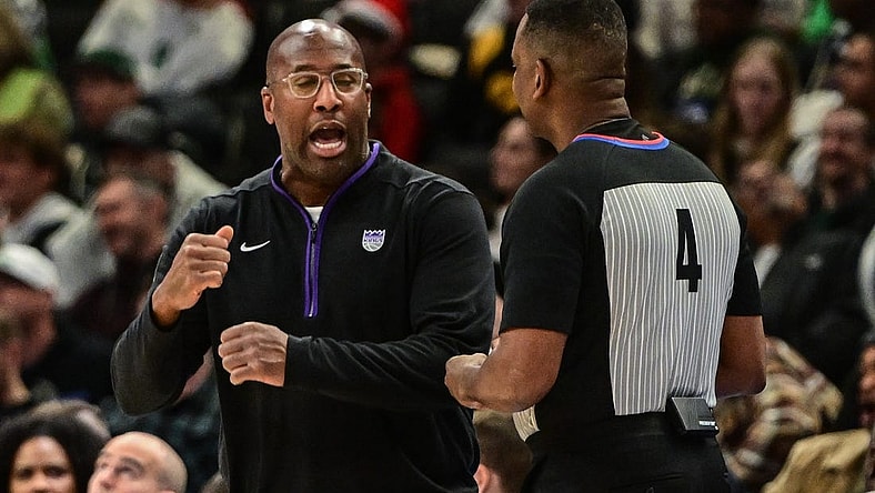 Dec 7, 2022; Milwaukee, Wisconsin, USA;  Sacramento Kings head coach Mike Brown talks to referee Sean Wright in the third quarter at Fiserv Forum. Mandatory Credit: Benny Sieu-USA TODAY Sports