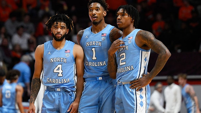 Dec 4, 2022; Blacksburg, Virginia, USA; North Carolina Tar Heels guard R.J. Davis (4) forward Leaky Black (1) and guard Caleb Love (2) at mid court during a Virginia Tech Hokies foul shot at Cassell Coliseum. Mandatory Credit: Lee Luther Jr.-USA TODAY Sports
