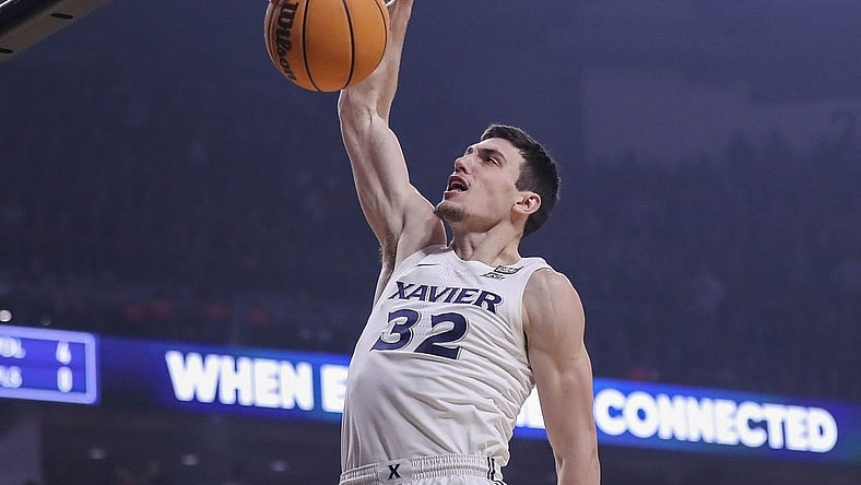 Dec 10, 2022; Cincinnati, Ohio, USA; Xavier Musketeers forward Zach Freemantle (32) dunks on the Cincinnati Bearcats in the first half at Fifth Third Arena. Mandatory Credit: Katie Stratman-USA TODAY Sports