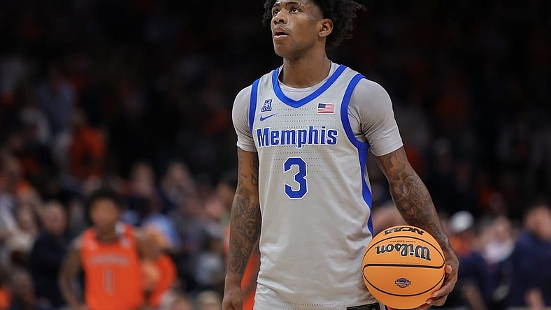 Dec 10, 2022; Atlanta, Georgia, USA; Memphis Tigers guard Kendric Davis (3) holds the ball against the Auburn Tigers in the second half at State Farm Arena. Mandatory Credit: Brett Davis-USA TODAY Sports