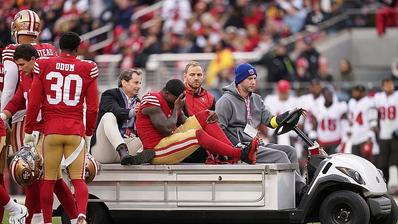 Dec 11, 2022; Santa Clara, California, USA; San Francisco 49ers wide receiver Deebo Samuel (19) is taken off the field after suffering an injury against the Tampa Bay Buccaneers in the second quarter at Levi's Stadium. Mandatory Credit: Cary Edmondson-USA TODAY Sports