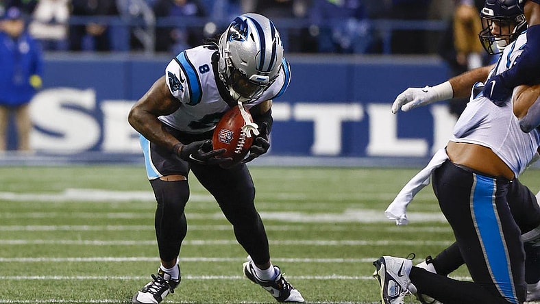 Dec 11, 2022; Seattle, Washington, USA; Carolina Panthers cornerback Jaycee Horn (8) recovers an onside kick against the Seattle Seahawks during the fourth quarter at Lumen Field. Mandatory Credit: Joe Nicholson-USA TODAY Sports