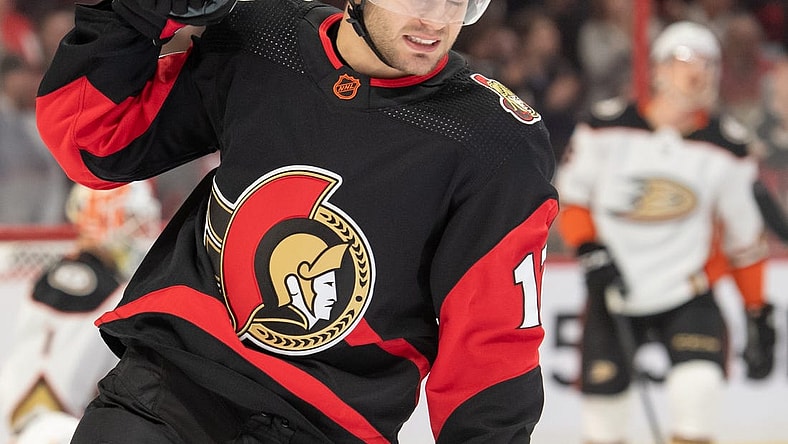 Dec 12, 2022; Ottawa, Ontario, CAN; Ottawa Senators right wing Alex DeBrincat (12) celebrates his goal scored in the first period against the Anaheim Ducks at the Canadian Tire Centre. Mandatory Credit: Marc DesRosiers-USA TODAY Sports
