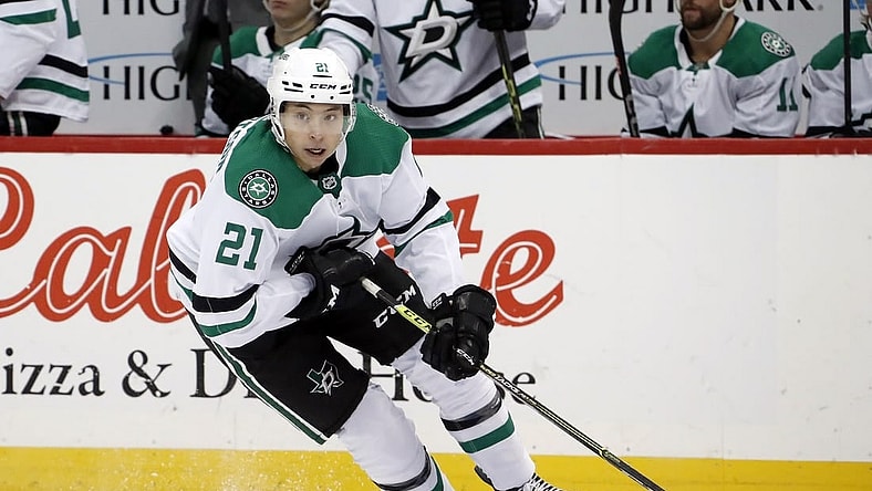 Dec 12, 2022; Pittsburgh, Pennsylvania, USA; Dallas Stars left wing Jason Robertson (21) skates with the puck against the Pittsburgh Penguins during the third period at PPG Paints Arena. The Penguins won 2-1. Mandatory Credit: Charles LeClaire-USA TODAY Sports