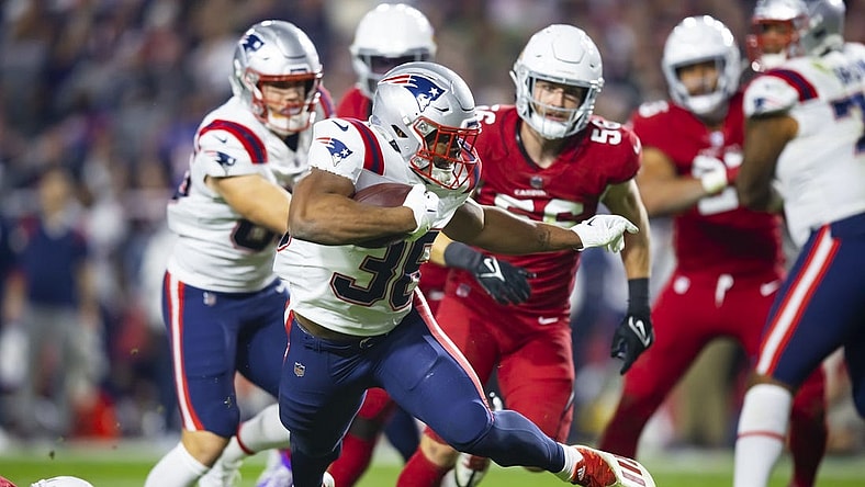 Dec 12, 2022; Glendale, Arizona, USA; New England Patriots running back Kevin Harris (36) scores a touchdown against the Arizona Cardinals in the first half at State Farm Stadium. Mandatory Credit: Mark J. Rebilas-USA TODAY Sports