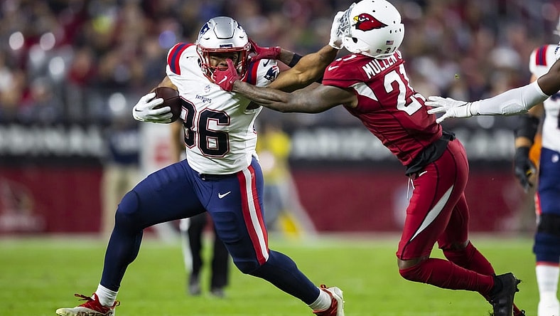 Dec 12, 2022; Glendale, Arizona, USA; New England Patriots running back Kevin Harris (36) is face masked by Arizona Cardinals cornerback Trayvon Mullen (21) in the first half at State Farm Stadium. Mandatory Credit: Mark J. Rebilas-USA TODAY Sports