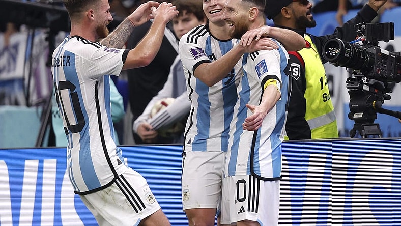 Dec 13, 2022; Lusail, Qatar; Argentina forward Julian Alvarez (9) celebrates with forward Lionel Messi (10) and midfielder Alexis Mac Allister (20) after scoring a goal against Croatia during the second half of a semifinal match during the 2022 World Cup at Lusail Stadium. Mandatory Credit: Yukihito Taguchi-USA TODAY Sports