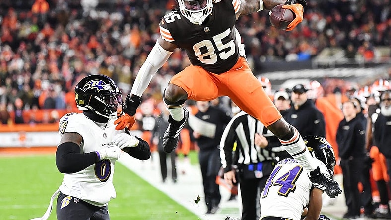 Dec 17, 2022; Cleveland, Ohio, USA; Cleveland Browns tight end David Njoku (85) leaps over Baltimore Ravens cornerback Marlon Humphrey (44) and linebacker Patrick Queen (6) after a catch during the first half at FirstEnergy Stadium. Mandatory Credit: Ken Blaze-USA TODAY Sports