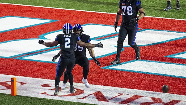 Dec 17, 2022; Albuquerque, New Mexico, USA; Brigham Young Cougars running back Christopher Books (2) celebrates after scoring a touchdown against the Southern Methodist Mustangs at University Stadium (Albuquerque). Mandatory Credit: Ivan Pierre Aguirre-USA TODAY Sports