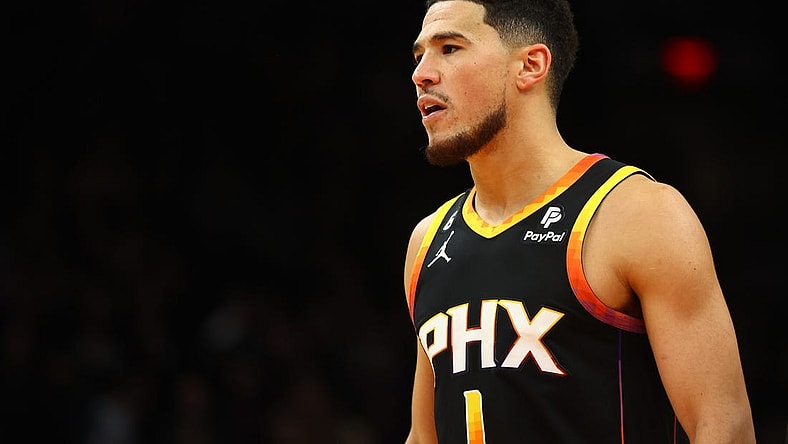 Dec 17, 2022; Phoenix, Arizona, USA; Phoenix Suns guard Devin Booker (1) against the New Orleans Pelicans in the second half at Footprint Center. Mandatory Credit: Mark J. Rebilas-USA TODAY Sports