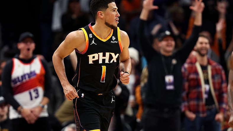 Dec 17, 2022; Phoenix, Arizona, USA; Phoenix Suns guard Devin Booker (1) against the New Orleans Pelicans at Footprint Center. Mandatory Credit: Mark J. Rebilas-USA TODAY Sports