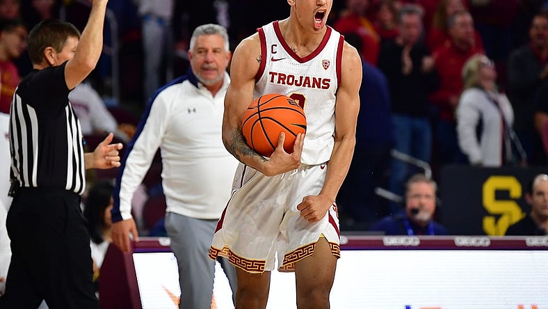 Dec 18, 2022; Los Angeles, California, USA; Southern California Trojans forward Kobe Johnson (0) reacts after drawing the foul against the Auburn Tigers during the second half at Galen Center. Mandatory Credit: Gary A. Vasquez-USA TODAY Sports