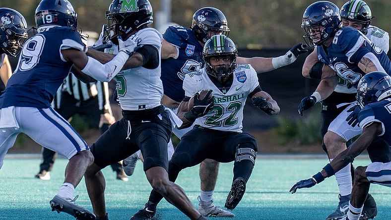 Dec 19, 2022; Conway, South Carolina, USA; Marshall Thundering Herd running back Rasheen Ali (22) looks for some running room in the first half against the Connecticut Huskies in the Myrtle Beach Bowl at Brooks Stadium. Mandatory Credit: David Yeazell-USA TODAY Sports