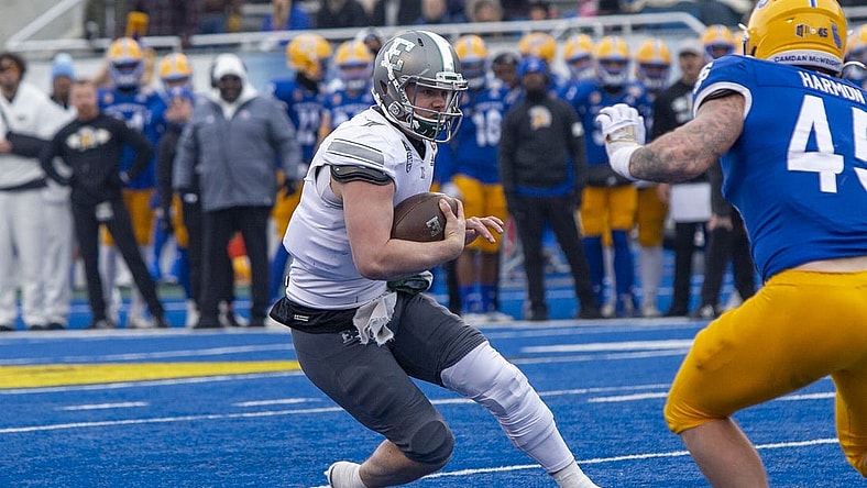 Dec 20, 2022; Boise, Idaho, USA; Eastern Michigan Eagles quarterback Taylor Powell (7) runs for a first down during the first half of action of the Famous Idaho Potato Bowl against the San Jose State Spartans at Albertsons Stadium. Mandatory Credit: Brian Losness-USA TODAY Sports
