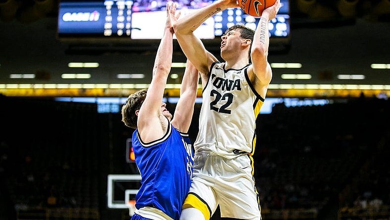 Iowa forward Patrick McCaffery (22) shoots a basket as Eastern Illinois guard Dan Luers defends during a NCAA men's basketball game, Wednesday, Dec. 21, 2022, at Carver-Hawkeye Arena in Iowa City, Iowa.

221221 Eastern Illinois Iowa Mbb 022 Jpg