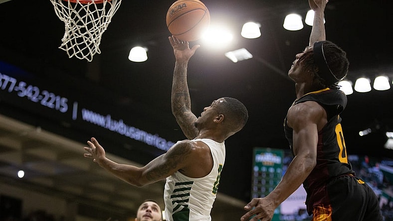 Dec 21, 2022; San Francisco, California, USA; San Francisco Dons guard Khalil Shabazz (left) is fouled by Arizona State Sun Devils guard DJ Horne (0) as he drives to the basket during the first half at War Memorial at the Sobrato Center. Mandatory Credit: D. Ross Cameron-USA TODAY Sports