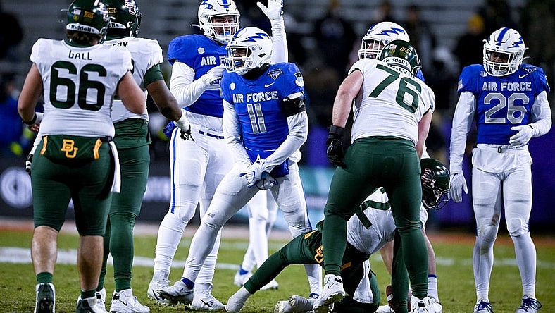Dec 22, 2022; Fort Worth, TX, USA; Air Force Falcons safety Camby Goff (11) celebrates after tacking Baylor Bears quarterback Blake Shapen (12) for a loss during the first half in the 2022 Armed Forces Bowl at Amon G. Carter Stadium. Mandatory Credit: Jerome Miron-USA TODAY Sports