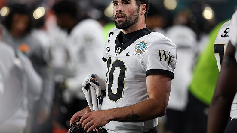 Dec 23, 2022; Tampa, Florida, USA; Wake Forest Demon Deacons quarterback Sam Hartman (10) looks on from the sidelines against the Missouri Tigers in the first quarter in the 2022 Gasparilla Bowl at Raymond James Stadium. Mandatory Credit: Nathan Ray Seebeck-USA TODAY Sports