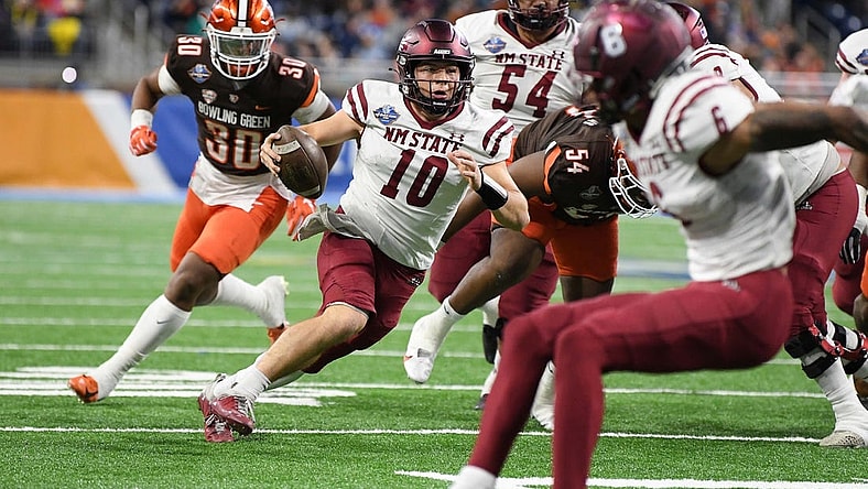 Dec 26, 2022; Detroit, Michigan, USA; New Mexico State quarterback Diego Pavia (10) scrambles for a first down against Bowling Green in the second quarter in the 2022 Quick Lane Bowl at Ford Field. Mandatory Credit: Lon Horwedel-USA TODAY Sports