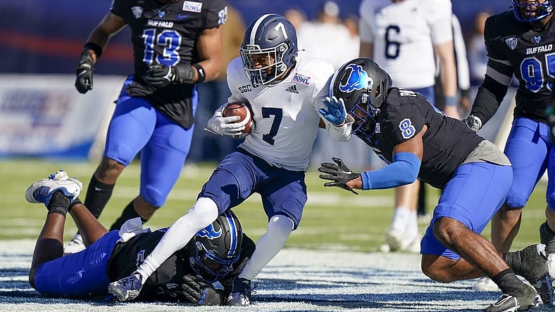 Dec 27, 2022; Montgomery, Alabama, USA; Georgia Southern Eagles wide receiver Khaleb Hood (7) is tackled by Buffalo Bulls defensive end C.J. Bazile (53) and linebacker James Patterson (8) during the first half in the 2022 Camellia Bowl at Cramton Bowl. Mandatory Credit: Marvin Gentry-USA TODAY Sports