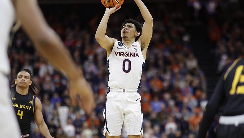 Dec 28, 2022; Charlottesville, Virginia, USA; Virginia Cavaliers guard Kihei Clark (0) shoots the ball against the Albany Great Danes in the second half at John Paul Jones Arena. Mandatory Credit: Geoff Burke-USA TODAY Sports