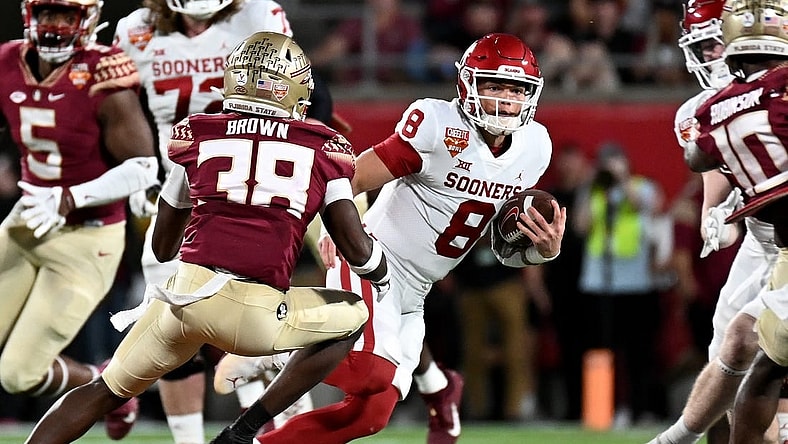 Dec 29, 2022; Orlando, Florida, USA; Oklahoma Sooners quarterback Gabriel Dillon (8) runs the ball in the first quarter against the Florida State Seminoles in the 2022 Cheez-It Bowl at Camping World Stadium. Mandatory Credit: Jonathan Dyer-USA TODAY Sports