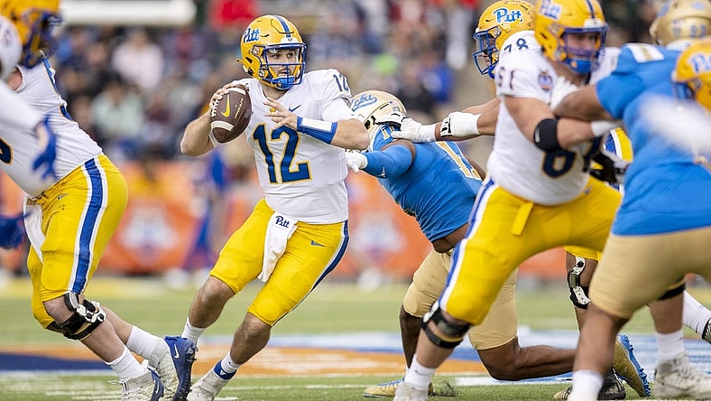 Dec 30, 2022; El Paso, Texas, USA; Pittsburgh Panthers quarterback Nick Patti (12) throws the ball against the UCLA Bruins defense in the first half of the 2022 Sun Bowl at Sun Bowl. Mandatory Credit: Ivan Pierre Aguirre-USA TODAY Sports