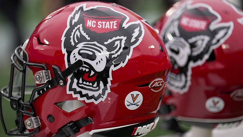 Dec 30, 2022; Charlotte, NC, USA; North Carolina State Wolfpack helmets during the first half against the Maryland Terrapins in the 2022 Duke's Mayo Bowl at Bank of America Stadium. Mandatory Credit: Jim Dedmon-USA TODAY Sports