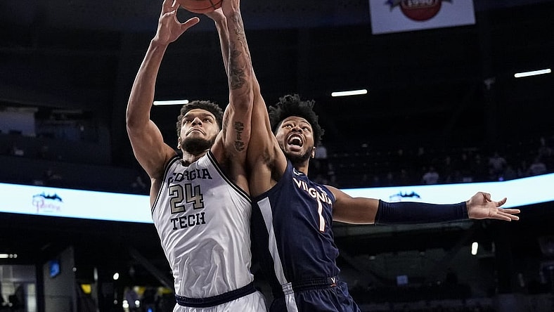 Dec 31, 2022; Atlanta, Georgia, USA; Georgia Tech Yellow Jackets center Rodney Howard (24) and Virginia Cavaliers forward Jayden Gardner (1) battle for the ball during the first half at McCamish Pavilion. Mandatory Credit: Dale Zanine-USA TODAY Sports