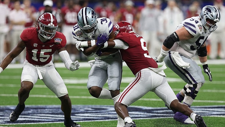 Dec 31, 2022; New Orleans, LA, USA; Kansas State Wildcats running back DJ Giddens (31) runs the ball against Alabama Crimson Tide defensive back Jordan Battle (9) during the first half in the 2022 Sugar Bowl at Caesars Superdome. Mandatory Credit: Stephen Lew-USA TODAY Sports