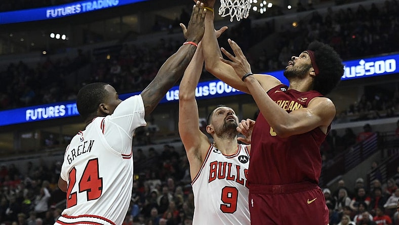 Dec 31, 2022; Chicago, Illinois, USA;  Chicago Bulls forward Javonte Green (24) and Chicago Bulls center Nikola Vucevic (9) fight for a rebound against Cleveland Cavaliers center Jarrett Allen (31) during the first half at United Center. Mandatory Credit: Matt Marton-USA TODAY Sports