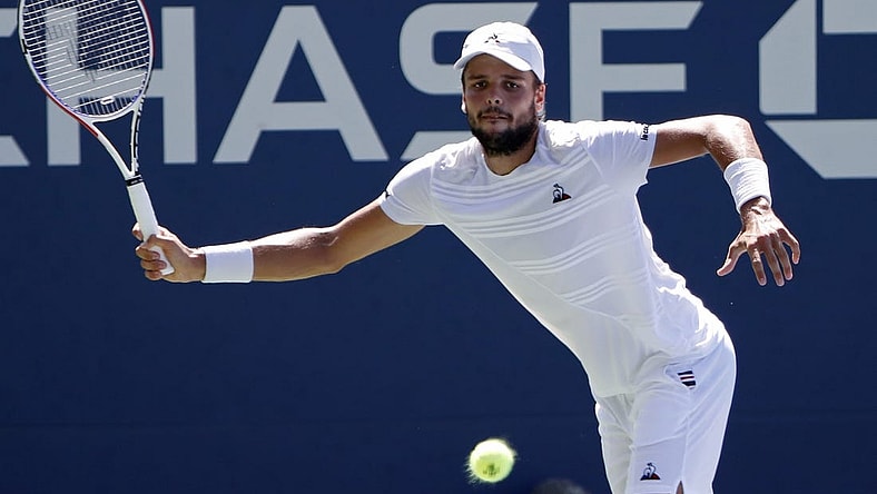 Aug 29, 2019; Flushing, NY, USA; Gregoire Barrere of France hits a forehand against David Goffin of Belgium (not pictured) in the second round on day four of the 2019 U.S. Open tennis tournament at USTA Billie Jean King National Tennis Center. Mandatory Credit: Geoff Burke-USA TODAY Sports