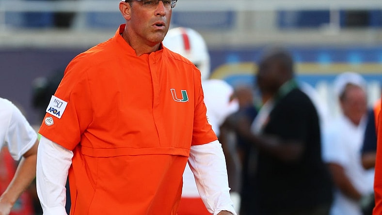 Aug 24, 2019; Orlando, FL, USA; Miami Hurricanes offensive coordinator Dan Enos prior to the game at Camping World Stadium. Mandatory Credit: Kim Klement-USA TODAY Sports