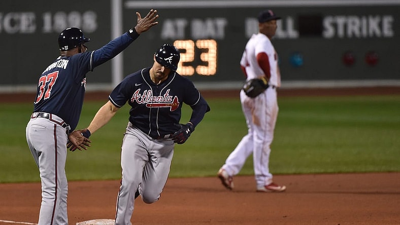 Sep 2, 2020; Boston, Massachusetts, USA;  Atlanta Braves third base coach Ron Washington (37) congratulates right fielder Adam Duvall (23) after hitting a two run home run during the sixth inning against the Boston Red Sox at Fenway Park. Mandatory Credit: Bob DeChiara-USA TODAY Sports