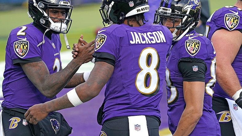 Dec 20, 2020; Baltimore, Maryland, USA; Baltimore Ravens quarterback Lamar Jackson (8) greets quarterback Tyler Huntley (2) prior to a game against the Jacksonville Jaguars at M&T Bank Stadium. Mandatory Credit: Mitch Stringer-USA TODAY Sports