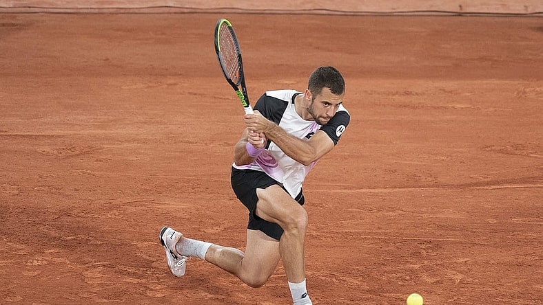Jun 4, 2021; Paris, France;  Laslo Djere (SRB) in action during his match against Alexander Zverev (GER) on day six of the French Open at Stade Roland Garros. Mandatory Credit: Susan Mullane-USA TODAY Sports