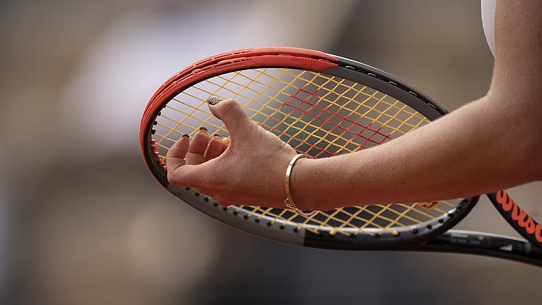 Jun 8, 2021; Paris, France; Detailed view of Anastasia Pavlyuchenkova's (RUS) fingernails on her racket during her match against Elena Rybakina (KAZ) on day 10 of the French Open at Stade Roland Garros. Mandatory Credit: Susan Mullane-USA TODAY Sports