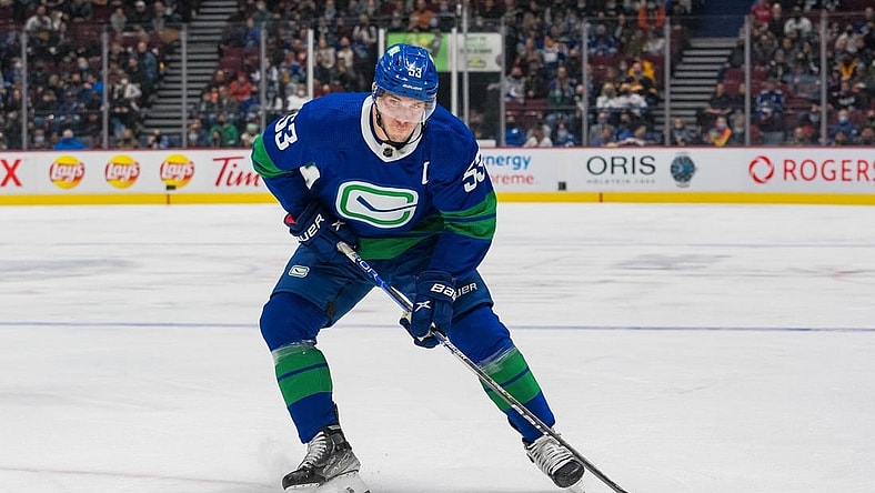 Nov 9, 2021; Vancouver, British Columbia, CAN; Vancouver Canucks forward Bo Horvat (53) shoots against the Anaheim Ducks at Rogers Arena. Mandatory Credit: Bob Frid-USA TODAY Sports
