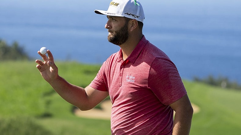 January 9, 2022; Maui, Hawaii, USA; Jon Rahm acknowledges the crowd after making his putt on the 13th hole during the final round of the Sentry Tournament of Champions golf tournament at Kapalua Resort - The Plantation Course. Mandatory Credit: Kyle Terada-USA TODAY Sports