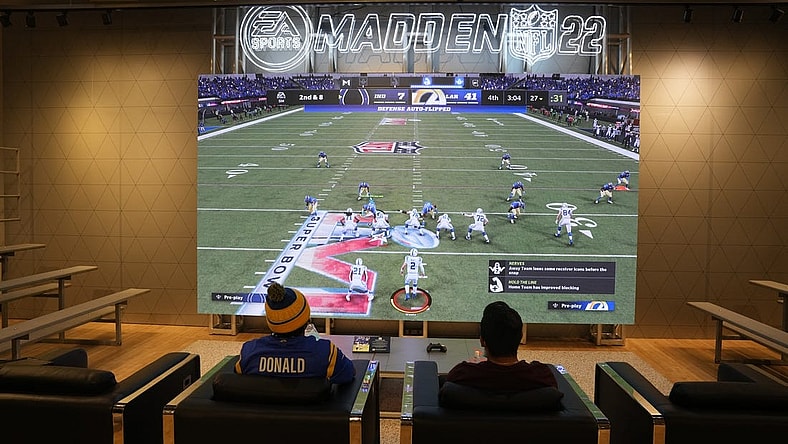 Feb 9, 2022; Los Angeles, CA, USA; People play EA Sports Madden 22 video game at the Nike store at the Grove. Mandatory Credit: Kirby Lee-USA TODAY Sports