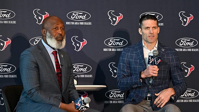 Feb 8, 2022; Houston, TX, USA; Houston Texans new head coach Lovie Smith (left) and general manager Nick Caserio (right) speak during the introductory press conference at NRG Stadium. Mandatory Credit: Maria Lysaker-USA TODAY Sports