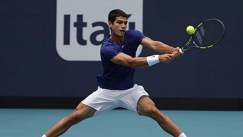 Apr 3, 2022; Miami Gardens, FL, USA; Carlos Alcaraz (ESP) hits a backhand against Casper Ruud (NOR)(not pictured) in the men's singles final in the Miami Open at Hard Rock Stadium. Mandatory Credit: Geoff Burke-USA TODAY Sports